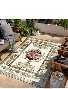 Outdoor wooden patio featuring a beige Persian rug with intricate vintage floral patterns