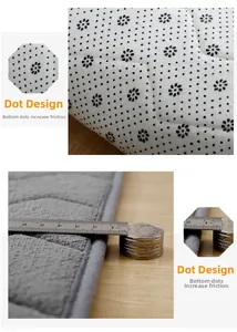 Detail of the non-slip dotted bottom and thickness of the gray coral fleece pet mat