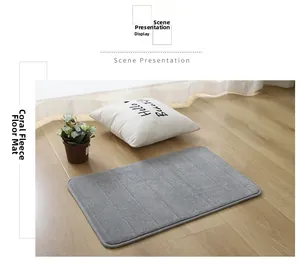 Macro shot of grey coral fleece pet mat with embossed stripe texture on wooden floor