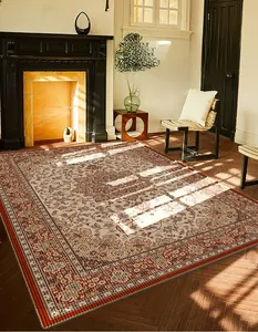 Detail of vintage Persian floral rug texture with warm natural sunlight in a home setting