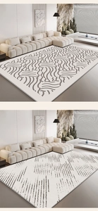 Detail view of modern minimalist rugs with wavy brown and black stripe patterns