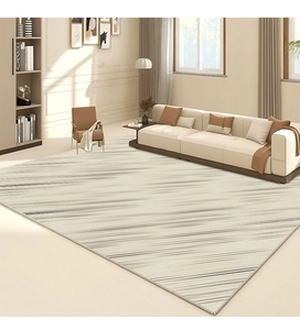 Detail of minimalist cream rug with black linear texture and neat edge stitching