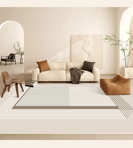 Detailed close-up of a minimalist cream rug with geometric lines in a modern living room