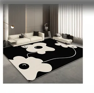 Detail view of modern black and white rug with large floral pattern for living room decor