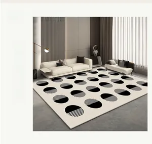 Detail of modern minimalist rug with black geometric circular patterns on light gray fabric