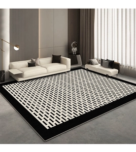 Modern black and white geometric carpet with minimalist rectangular patterns in a living room