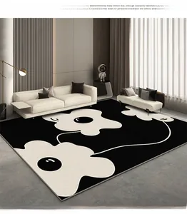 Detail of minimalist black and white daisy pattern rug in a modern living room setting