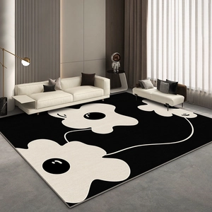 Modern minimalist black and white carpet with bold floral patterns in a luxury living room