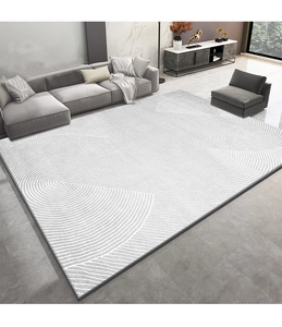 Détail d'un tapis aux motifs de vagues gris et blanc dans un salon moderne et épuré