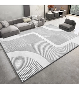 Vue de dessus d'un tapis géométrique gris et blanc avec des vagues modernes dans un salon