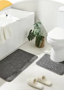 Close-up of non-slip pebble embossed coral fleece bathroom rug set in dark grey