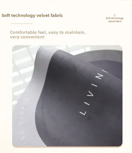 Close-up of gray diatom mud mat texture with Living Simple text and anti-slip surface