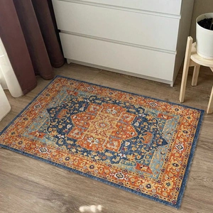 Bohemian vintage rug in orange and navy blue with Persian geometric floral patterns