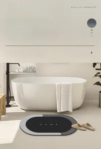 Close-up of oval anti-slip bath mat made of absorbent technical velvet fabric with HOME text