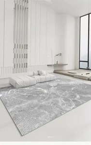 Detail showing the gray marble texture and artistic linear pattern on the rectangular rug