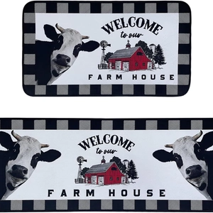 Two-piece farmhouse kitchen rugs featuring cartoon cows and barns with black-white checkered edge