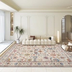 Top view of a Persian floral area rug with vintage patterns in a bright modern living room