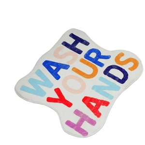 Cloud shaped faux cashmere bath mat with Wash Your Hands text and non-slip backing