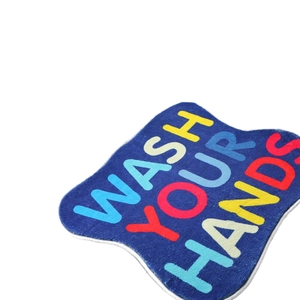 Navy blue faux cashmere bath mat featuring colorful WASH YOUR HANDS text and non-slip backing