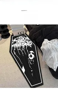 Detail view of gothic coffin-shaped rug with white portrait print on black plush fabric
