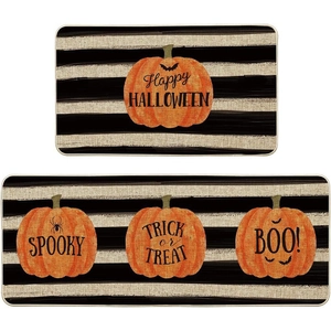 Detailed set of Halloween kitchen mats featuring orange pumpkins and striped patterns