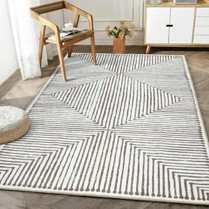 Detail of modern geometric living room rug with linear pattern on wooden floor