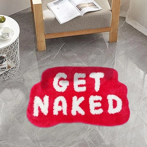 Red Get Naked irregular bathroom rug with non-slip backing on marble floor