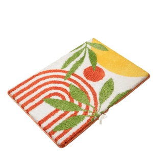 Abstract faux cashmere bath mat with 3D tufted botanical pattern and non-slip backing