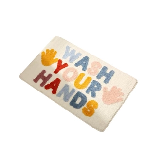 Wash Your Hands alphabet bath mat with colorful palm print on soft white faux cashmere