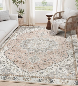 Macro detail of Persian style area rug with vintage medallion pattern in pink and grey