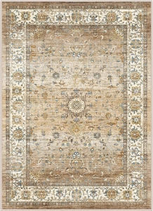 Close-up of traditional Persian rug with vintage distressed floral patterns in beige and brown