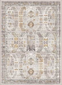 Detail view of vintage Persian rug featuring intricate floral patterns and distressed texture