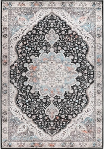 Close-up of distressed Persian rug with traditional central medallion and floral borders