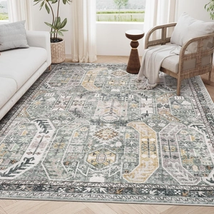 Close-up of vintage Persian area rug showing green geometric patterns and detailed edging