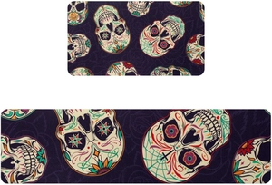 Detail of Day of the Dead kitchen mats featuring colorful sugar skulls on purple fabric