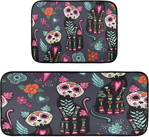 Detail of Day of the Dead kitchen rugs with black cat and colorful floral skull patterns