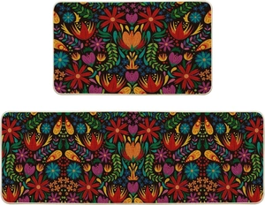 Detail of kitchen floor mats featuring colorful folk floral patterns and stitched edges