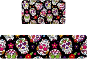 Detail of Day of the Dead kitchen mats set with colorful sugar skulls and floral patterns