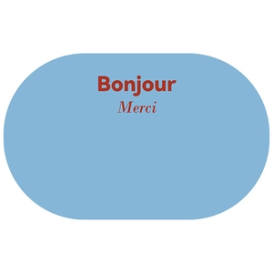 Detail of minimalist bath mat showing light blue oval design with Bonjour and Merci text