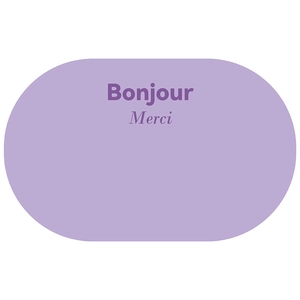 Detail showing plush purple bathroom mat with Bonjour and Merci typography print