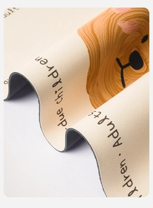 Close-up of thickened non-slip rubber backing and soft cartoon dog pattern mat texture