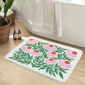 Floral cashmere-feel bath mat with non-slip backing on a modern bathroom floor