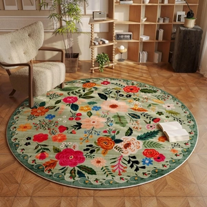 Round floral faux cashmere rug in pale green with colorful flower patterns for living room