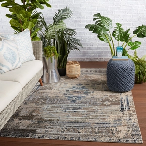 Close-up of Bohemian outdoor rug featuring intricate tribal patterns in blue and beige