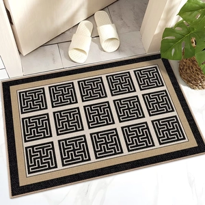 Detail of French luxury door mat showing anti-slip fabric texture and geometric pattern