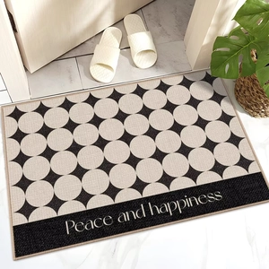 Detailed texture of beige polka dot door mat with Peace and Happiness text design