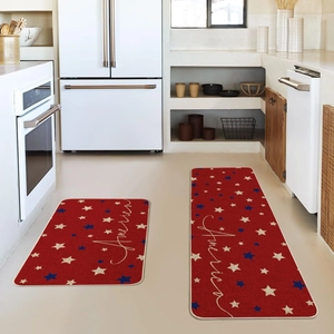 Detail view of red American flag style kitchen mats with white stars and America script