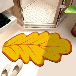 Λεπτομέρεια από κίτρινο χαλάκι μπάνιου σε σχήμα φύλλου με ανάγλυφες φλέβες φύλλων