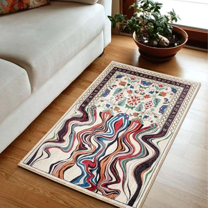 Modern bohemian rug with colorful floral waves and patterns on light wood flooring