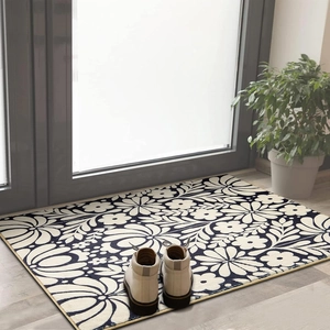 Detail of bohemian rectangle rug with navy floral pattern and durable stitched edges